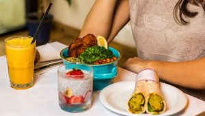 Tasty chicken salad with roller and dessert